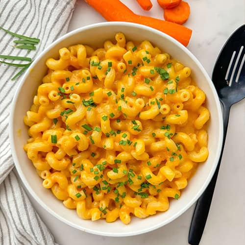 Creamy macaroni and cheese made with carrots blended into the sauce.